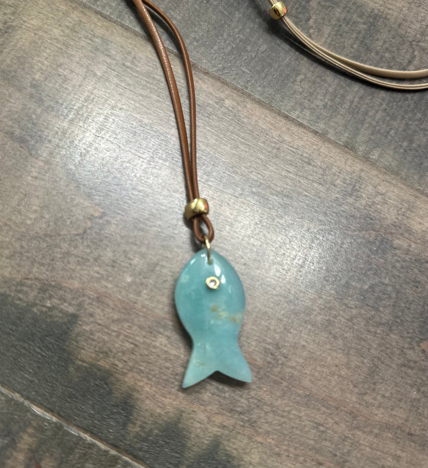 ADJUSTABLE CORD NECKLACE WITH FISH PENDANT